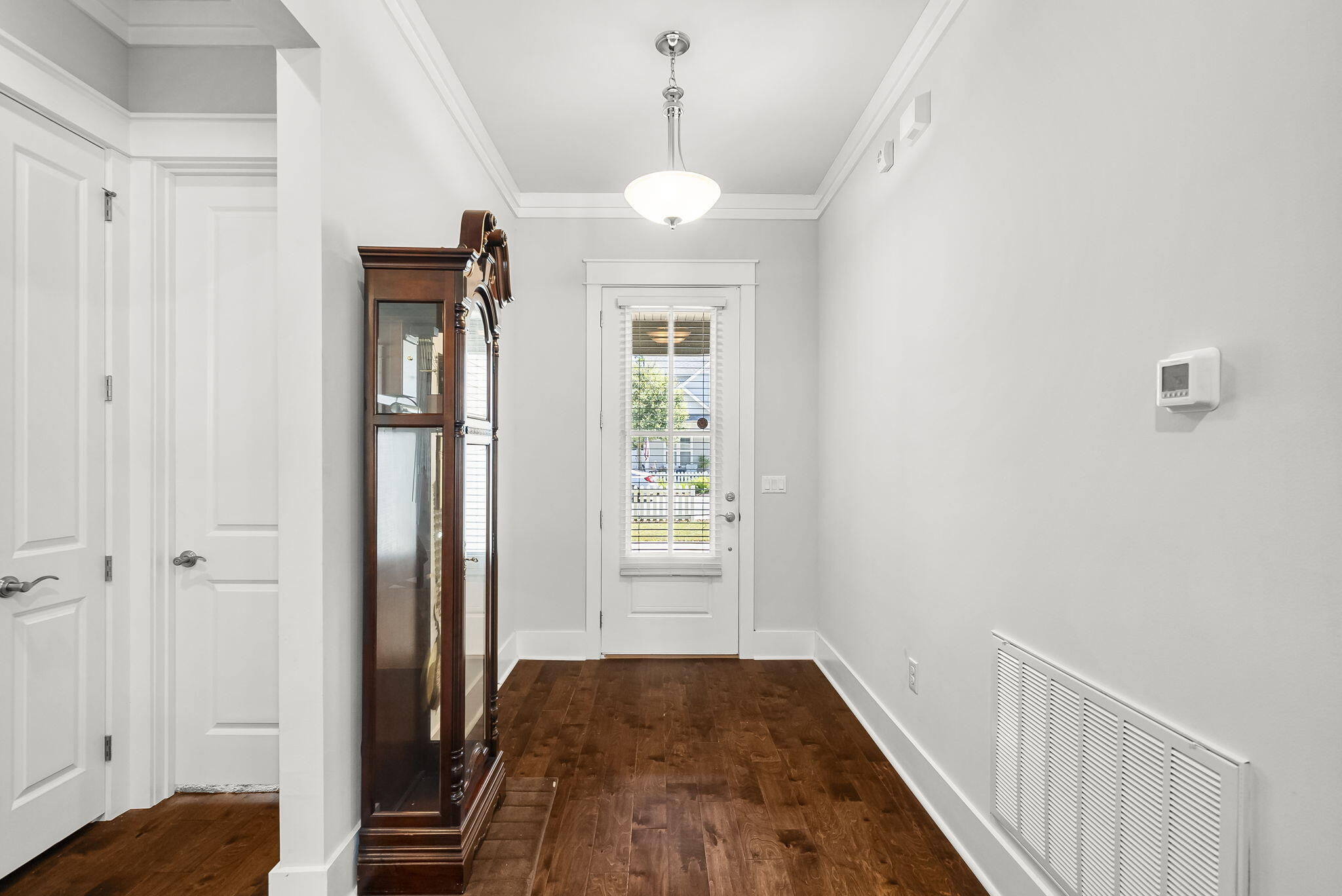 209 Blakely Drew Boulevard Santa Rosa Beach, FL 32459 - Photo 7 of 45 a view of a hallway view with wooden floor and staircase