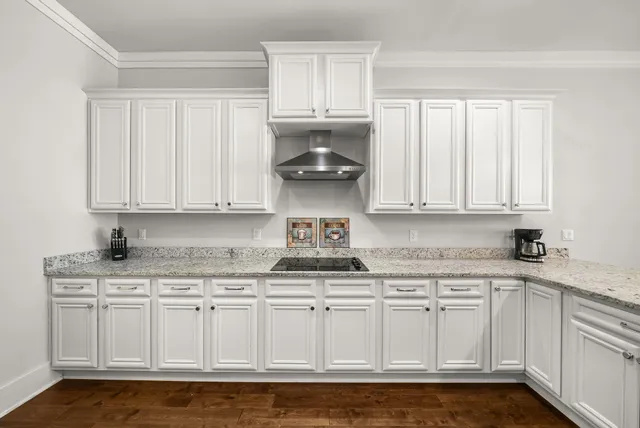a kitchen with stainless steel appliances granite countertop a sink and cabinets
