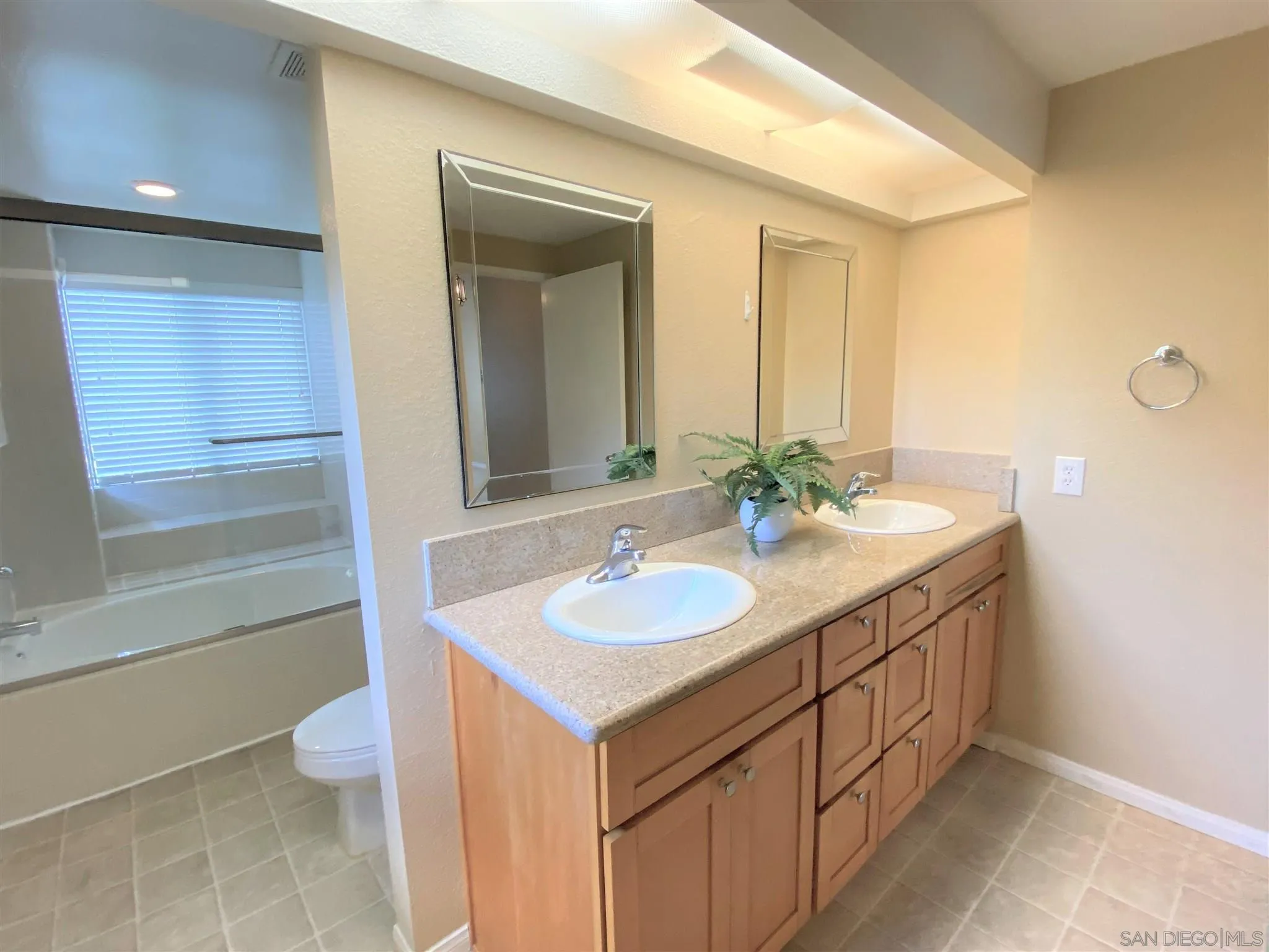 3195 Morning Way La Jolla, CA 92037 - Photo 13 of 18 a bathroom with a granite countertop sink and a mirror