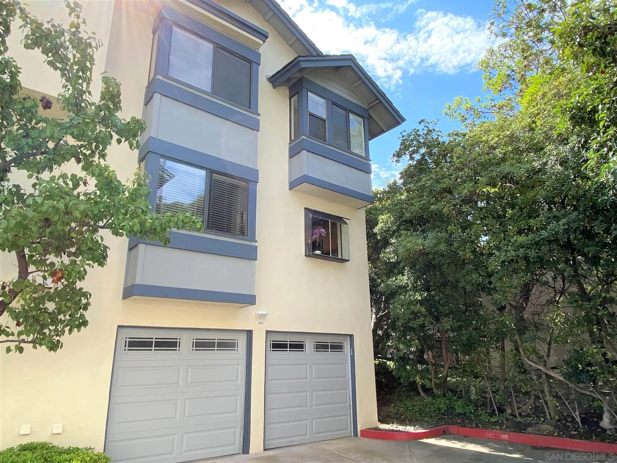 3195 Morning Way La Jolla, CA 92037 - Photo 14 of 18 front view of a house with a trees