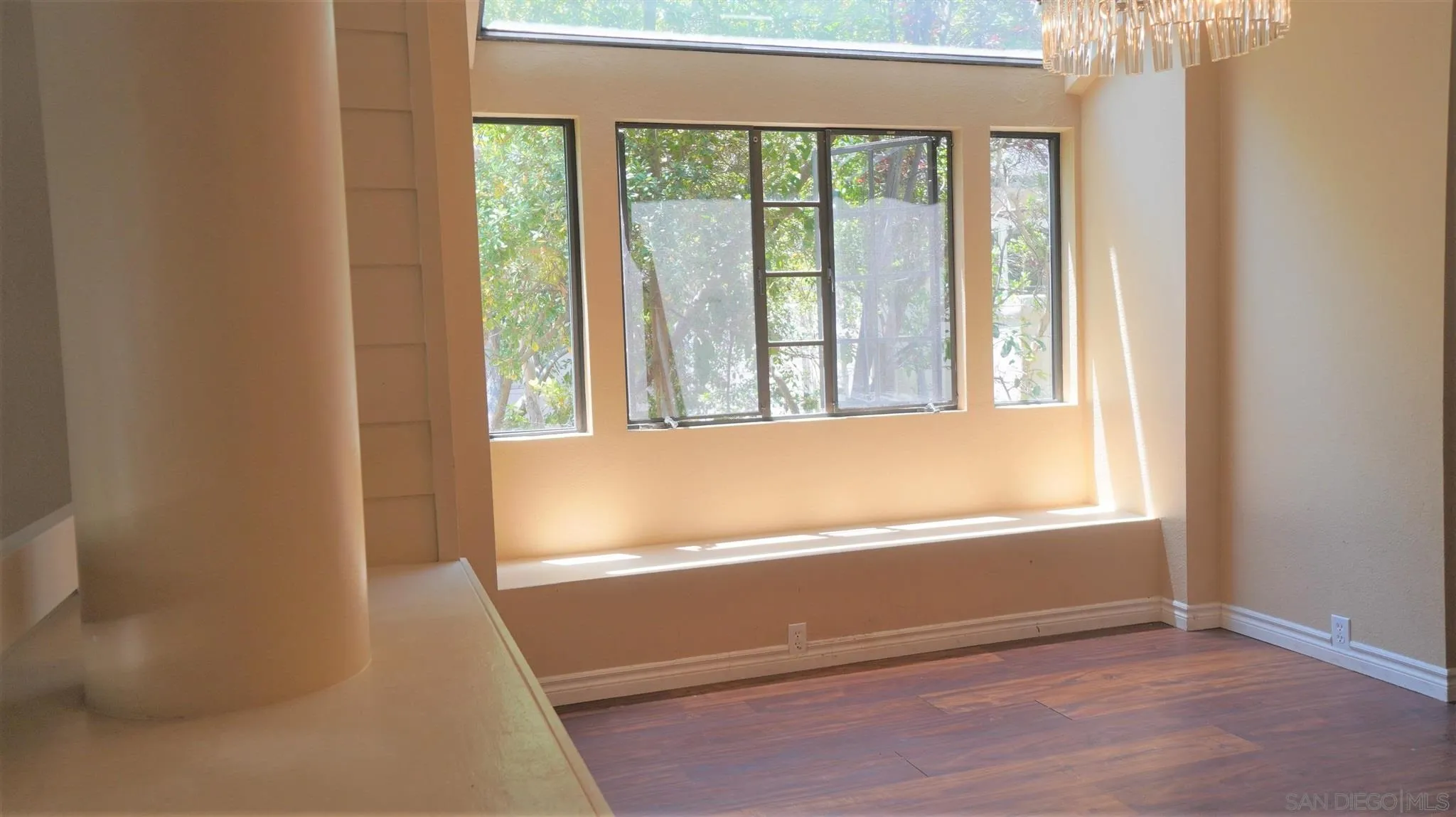 3195 Morning Way La Jolla, CA 92037 - Photo 3 of 18 a view of an empty room with wooden floor and a window
