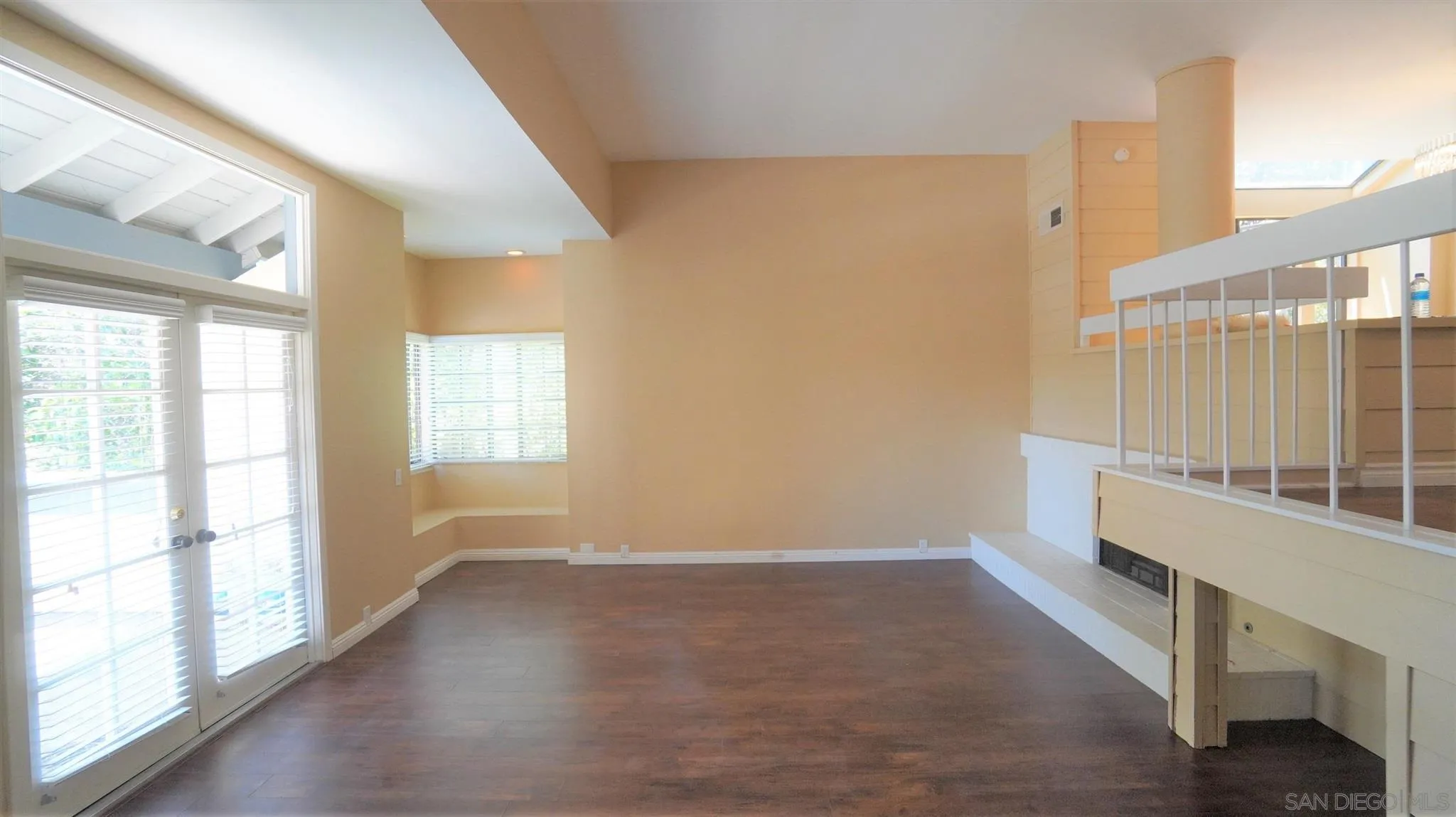 3195 Morning Way La Jolla, CA 92037 - Photo 5 of 18 wooden floor in an empty room with a window