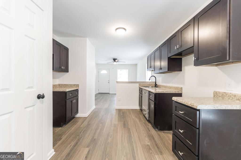 180 Ward Street Macon, GA 31204 - Photo 11 of 26 a large kitchen with a sink stainless steel appliances and cabinets