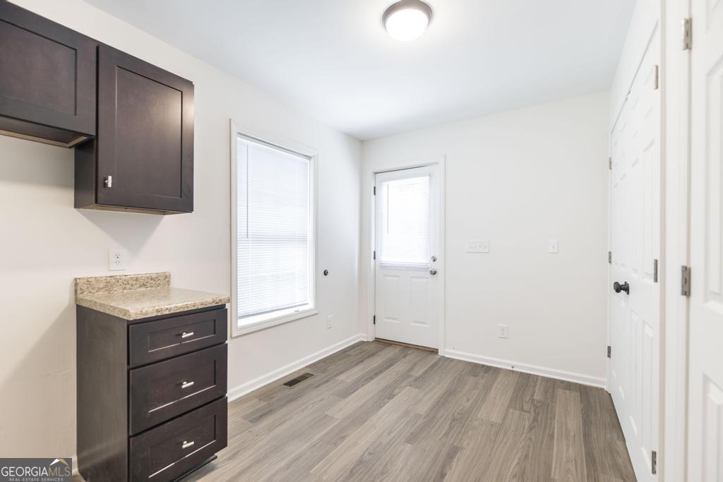 180 Ward Street Macon, GA 31204 - Photo 12 of 26 a view of a livingroom with wooden floor