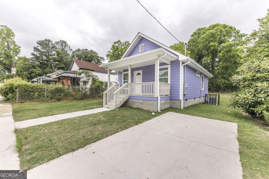 180 Ward Street Macon, GA 31204 - Photo 2 of 26 a view of a house with a yard