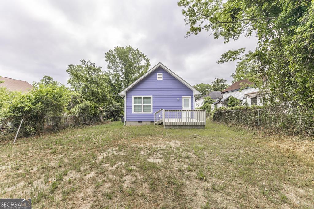 180 Ward Street Macon, GA 31204 - Photo 24 of 26 a backyard of a house with table and chairs