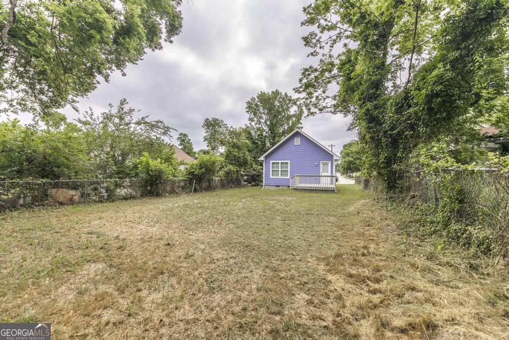 180 Ward Street Macon, GA 31204 - Photo 25 of 26 a view of a house with a yard and large trees