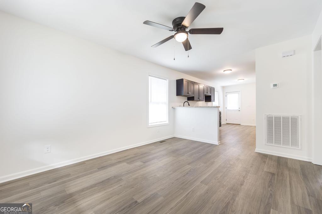 180 Ward Street Macon, GA 31204 - Photo 5 of 26 a view of a kitchen with a dishwasher and wooden floor
