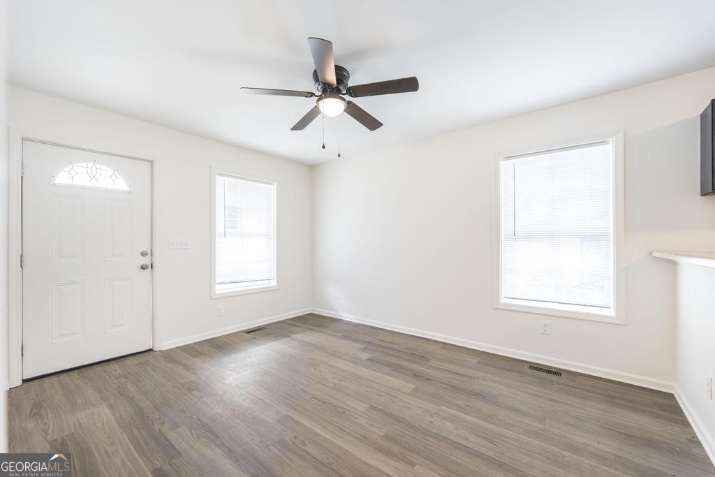 180 Ward Street Macon, GA 31204 - Photo 7 of 26 a view of empty room with wooden floor and fan