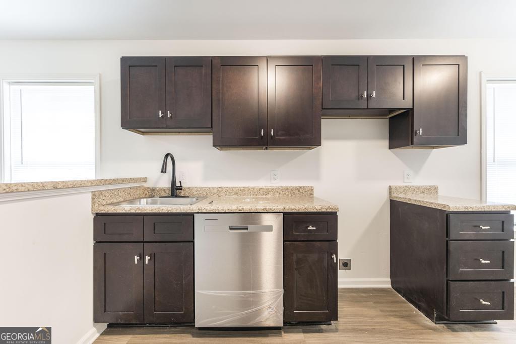 180 Ward Street Macon, GA 31204 - Photo 9 of 26 a kitchen with stainless steel appliances granite countertop a sink and a microwave