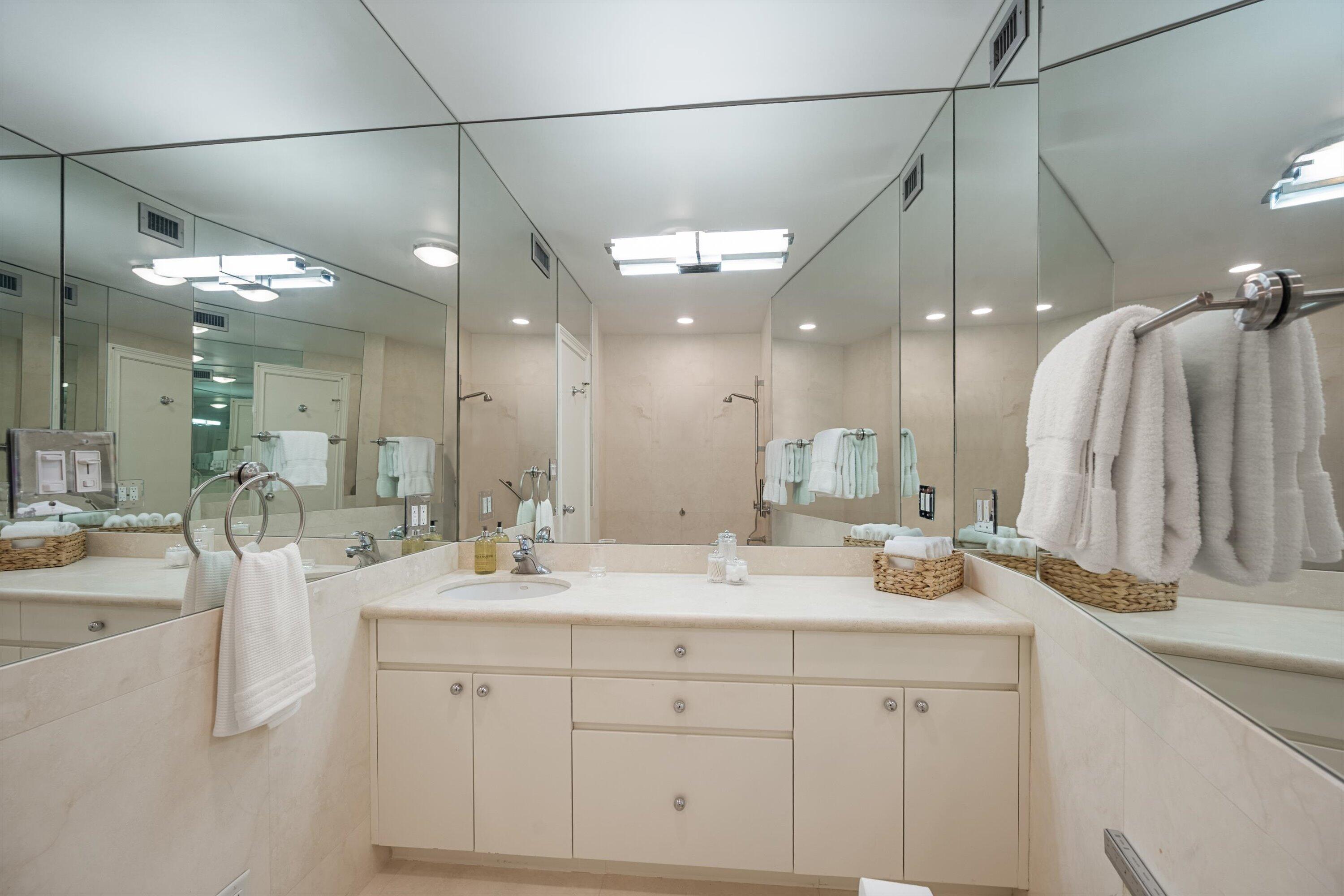 44 Cocoanut Row, Unit 514A Palm Beach, FL 33480 - Photo 13 of 34 a bathroom with a double vanity sink mirror and shower