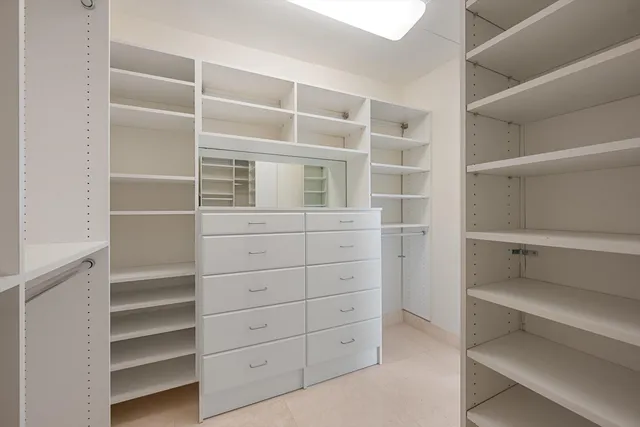 a bedroom with a bed and flat screen tv