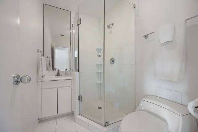 a view of a backyard with furniture and garden