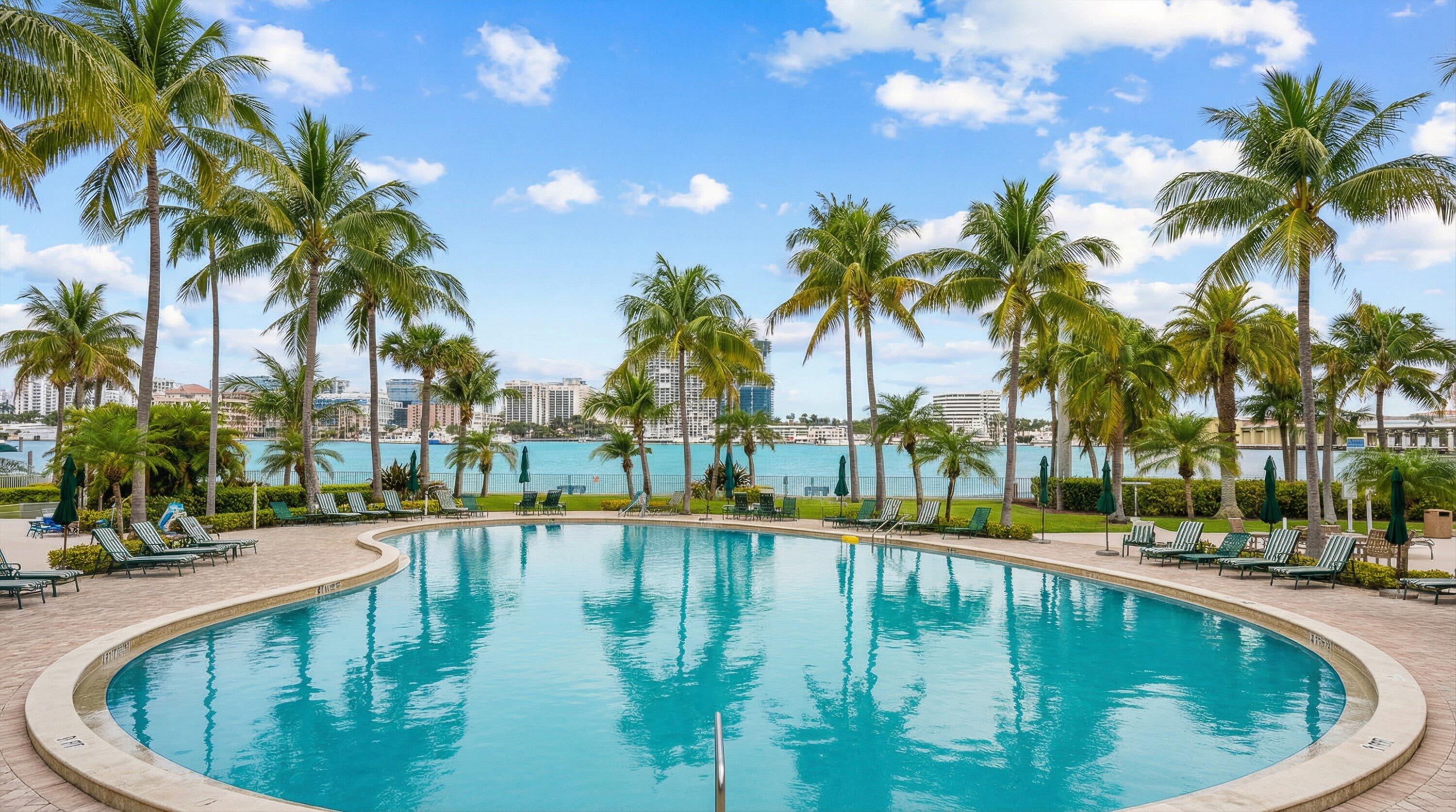 44 Cocoanut Row, Unit 514A Palm Beach, FL 33480 - Photo 30 of 34 a view of swimming pool with a table and chairs