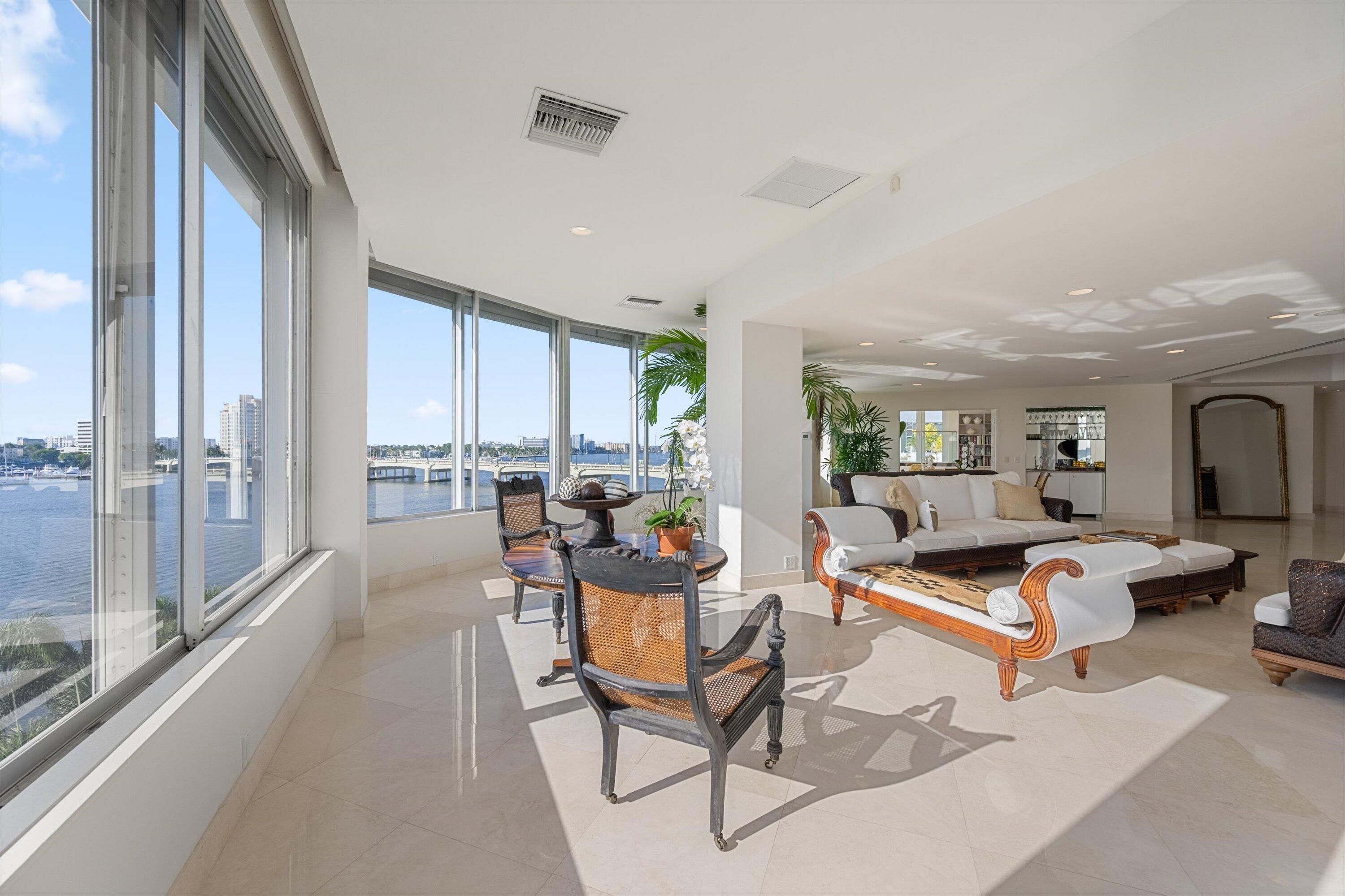 44 Cocoanut Row, Unit 514A Palm Beach, FL 33480 - Photo 5 of 34 a living room with furniture a rug and a large window