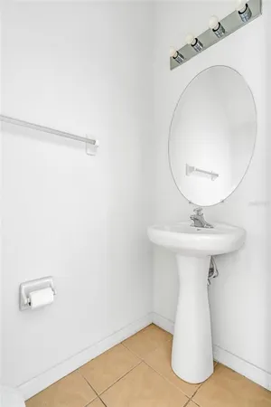 a bathroom with a sink and mirror