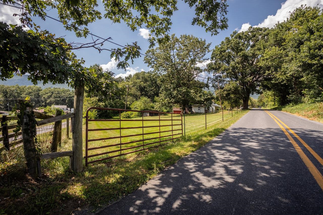 a view of park with wooden fence