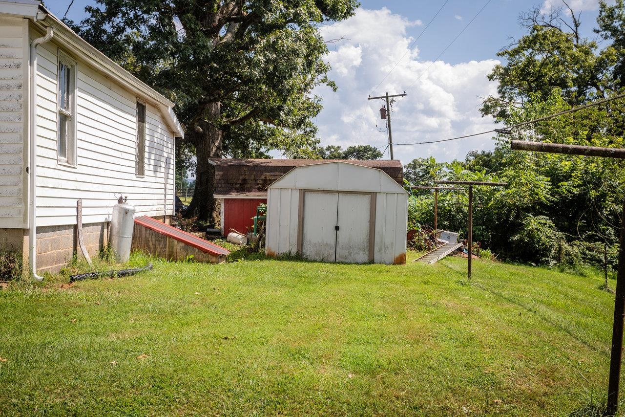 1557 Rinacas Corner Road Shenandoah, VA 22849 - Photo 17 of 32 a view of a house with backyard and sitting area