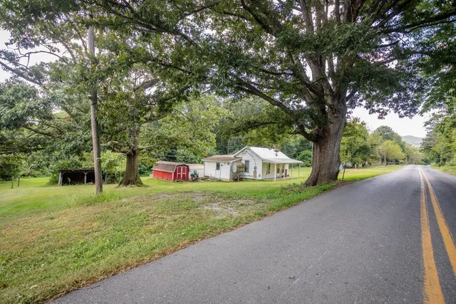 a view of a lake with a yard