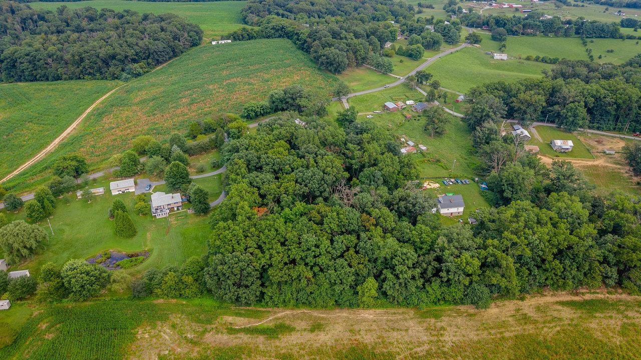 1557 Rinacas Corner Road Shenandoah, VA 22849 - Photo 25 of 32 a view of a lake with a yard