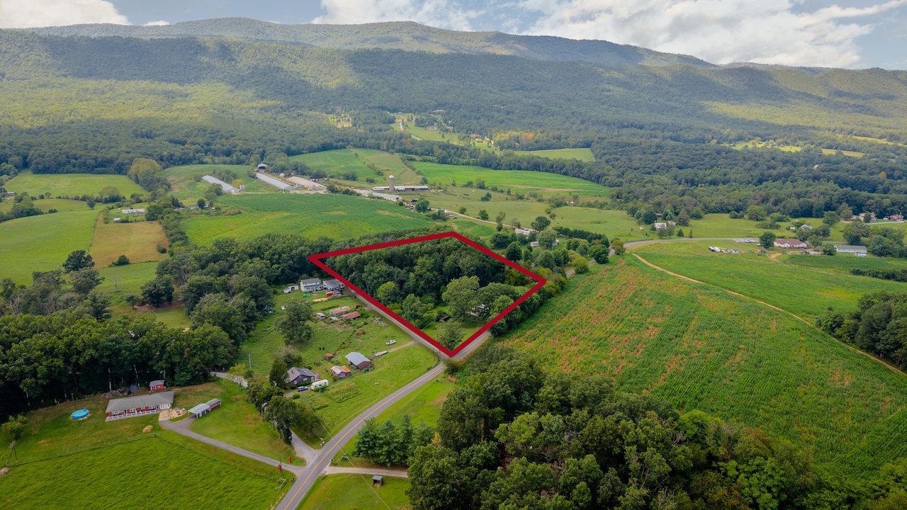 1557 Rinacas Corner Road Shenandoah, VA 22849 - Photo 29 of 32 an aerial view of residential houses with outdoor space and trees