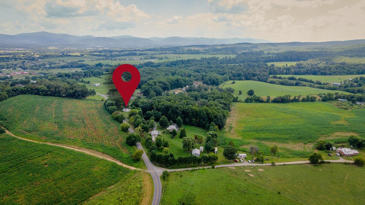 1557 Rinacas Corner Road Shenandoah, VA 22849 - Photo 30 of 32 an aerial view of a house with a yard and lake view
