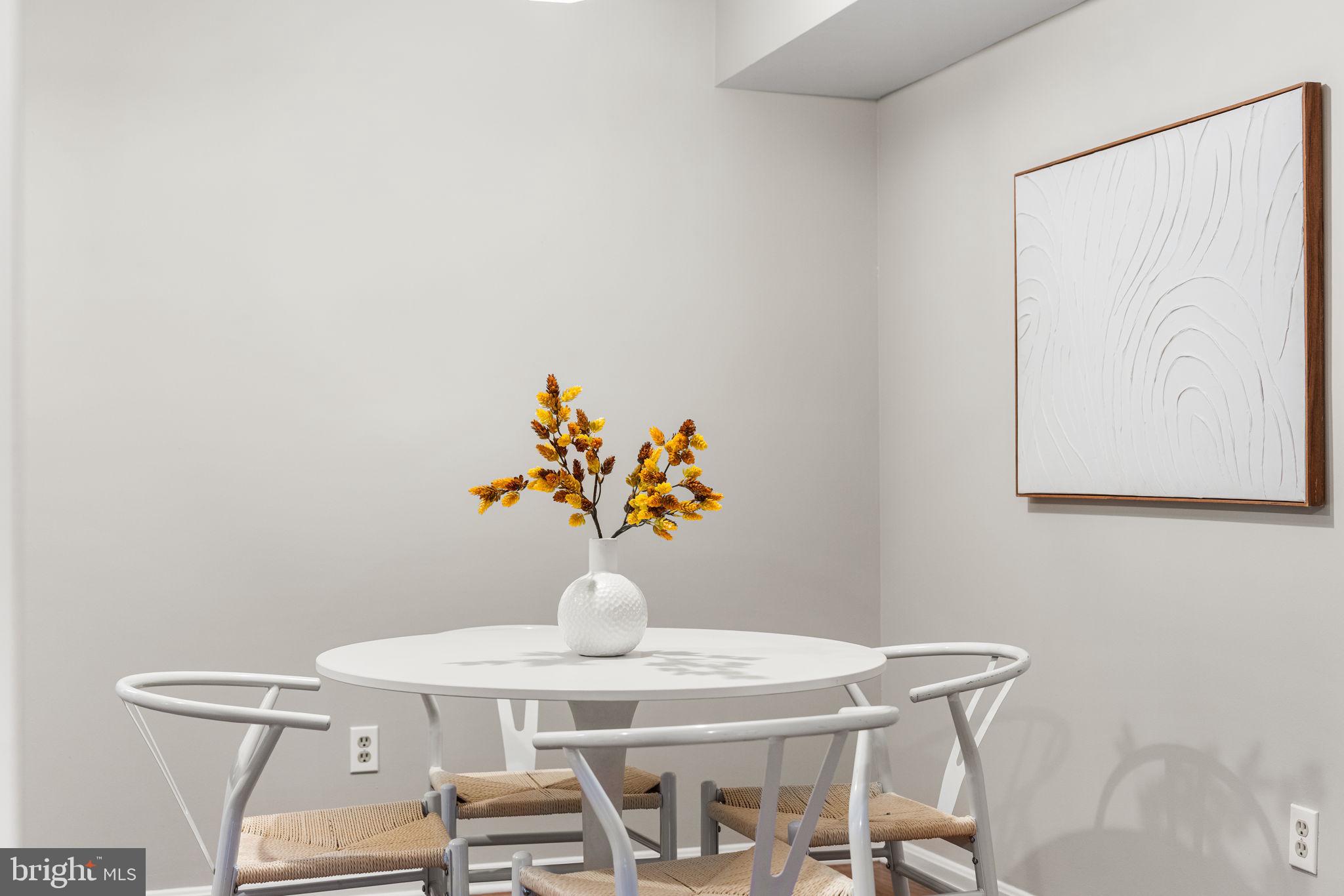 4931 7th Road South, Unit 4931 Arlington, VA 22204 - Photo 11 of 25 a view of a dining room with furniture and wooden floor