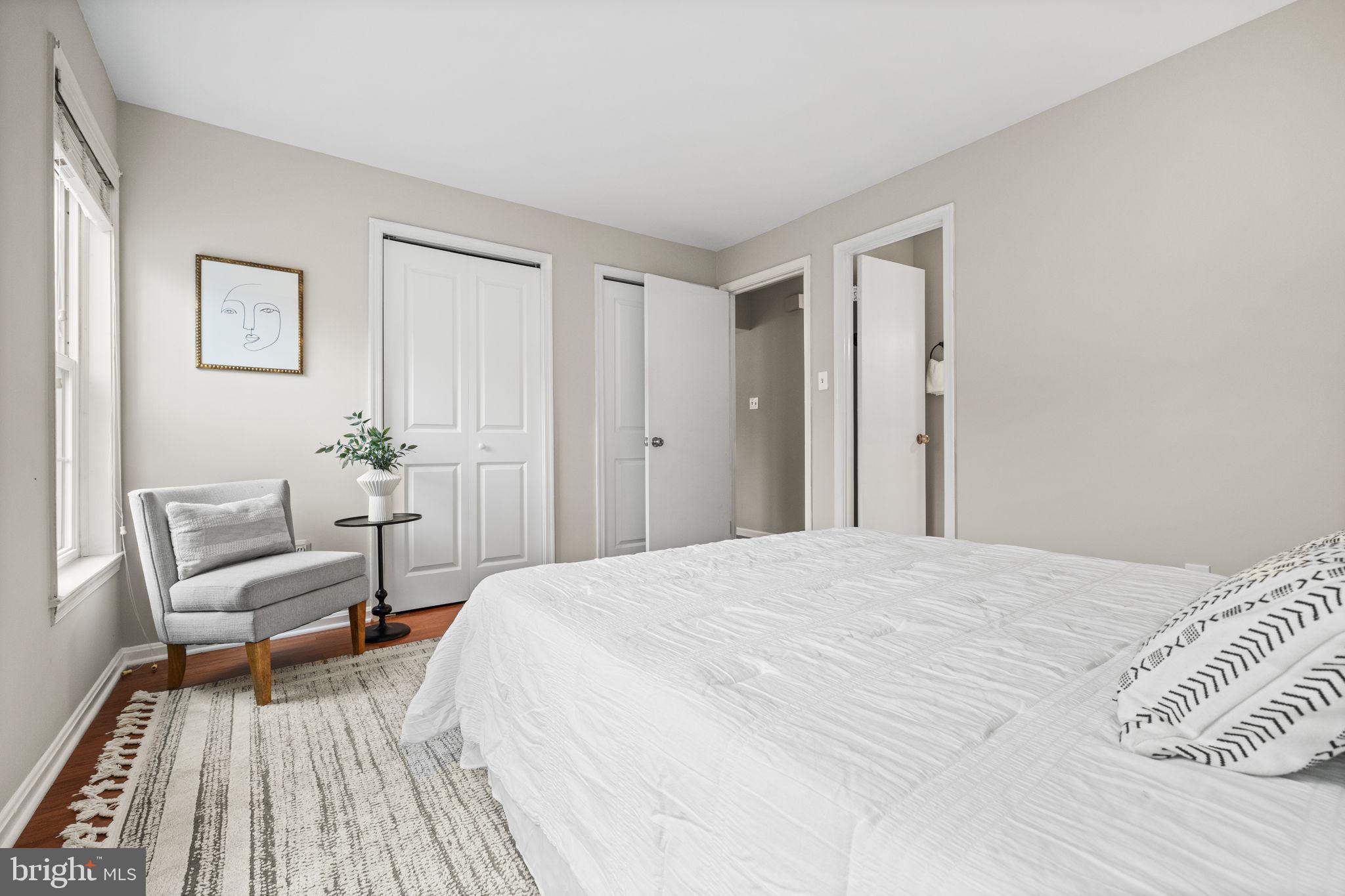 4931 7th Road South, Unit 4931 Arlington, VA 22204 - Photo 16 of 25 a bedroom with a bed and a chair