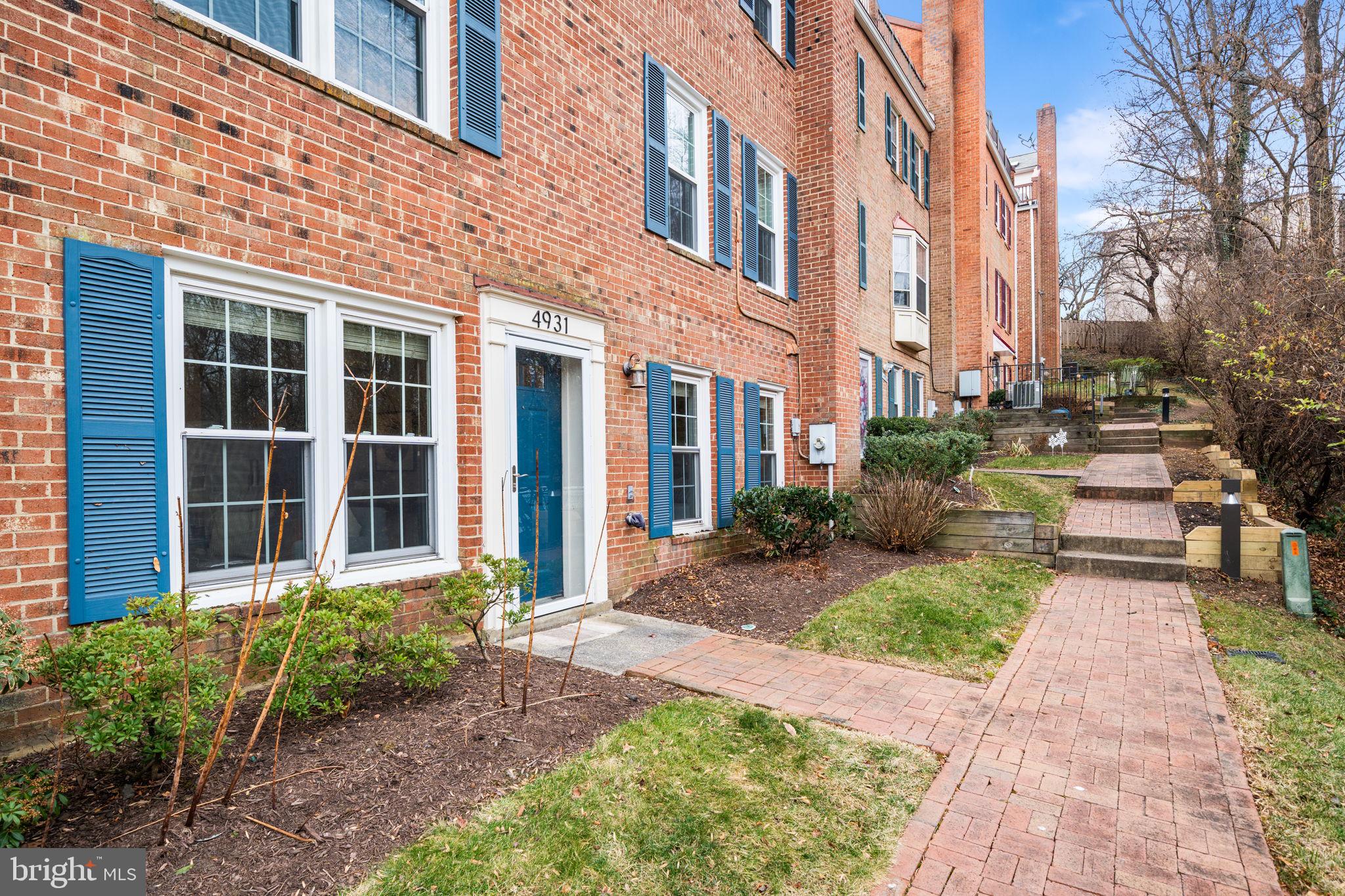 4931 7th Road South, Unit 4931 Arlington, VA 22204 - Photo 2 of 25 a view of a brick building next to a yard