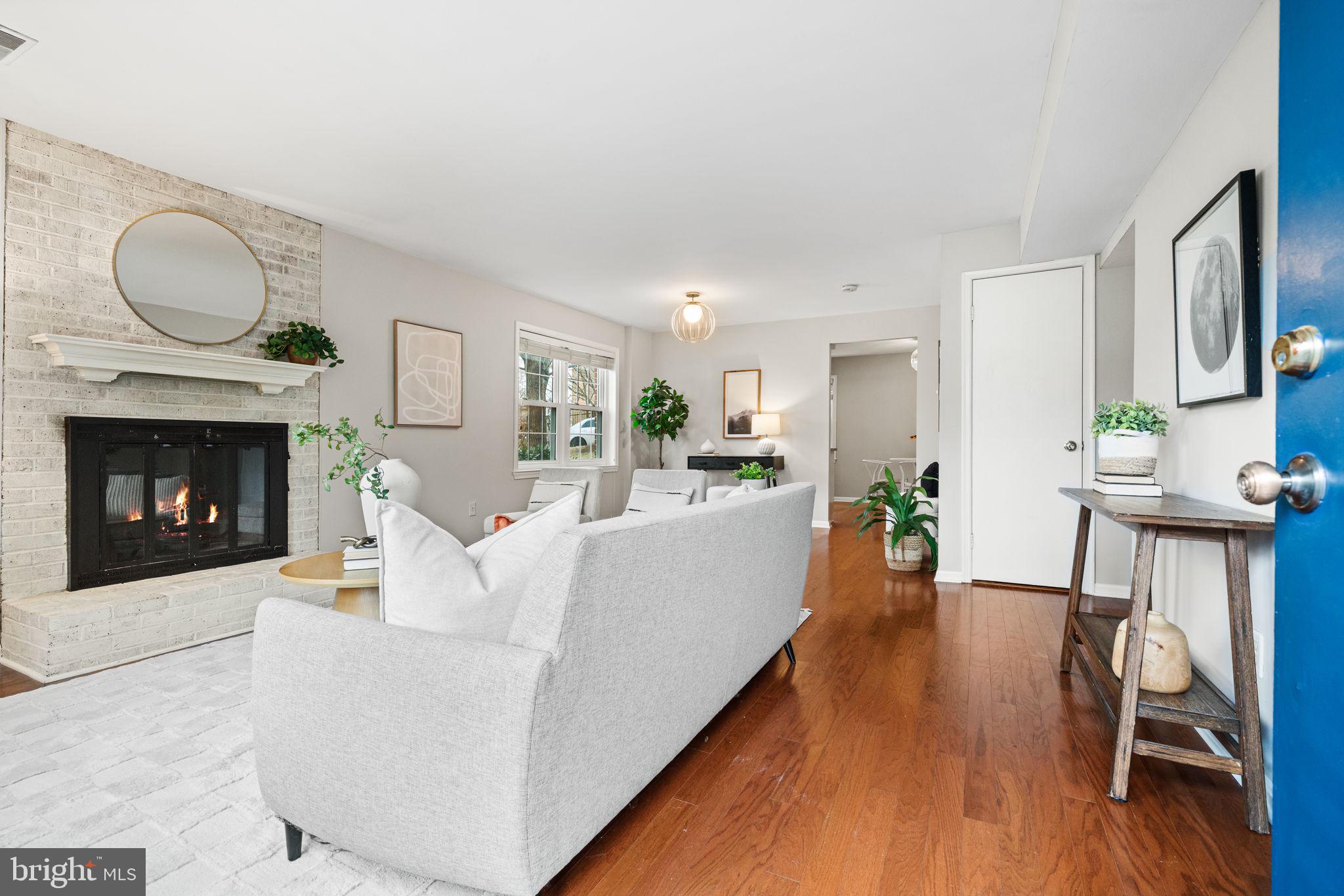 4931 7th Road South, Unit 4931 Arlington, VA 22204 - Photo 3 of 25 a living room with furniture and a fireplace