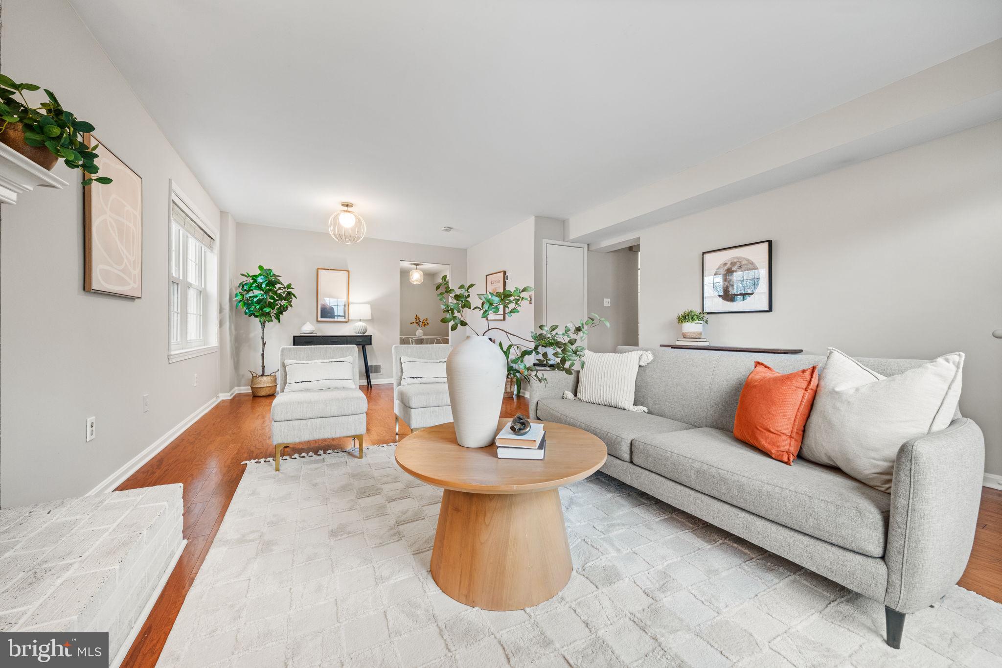 4931 7th Road South, Unit 4931 Arlington, VA 22204 - Photo 4 of 25 a living room with furniture and a wooden floor