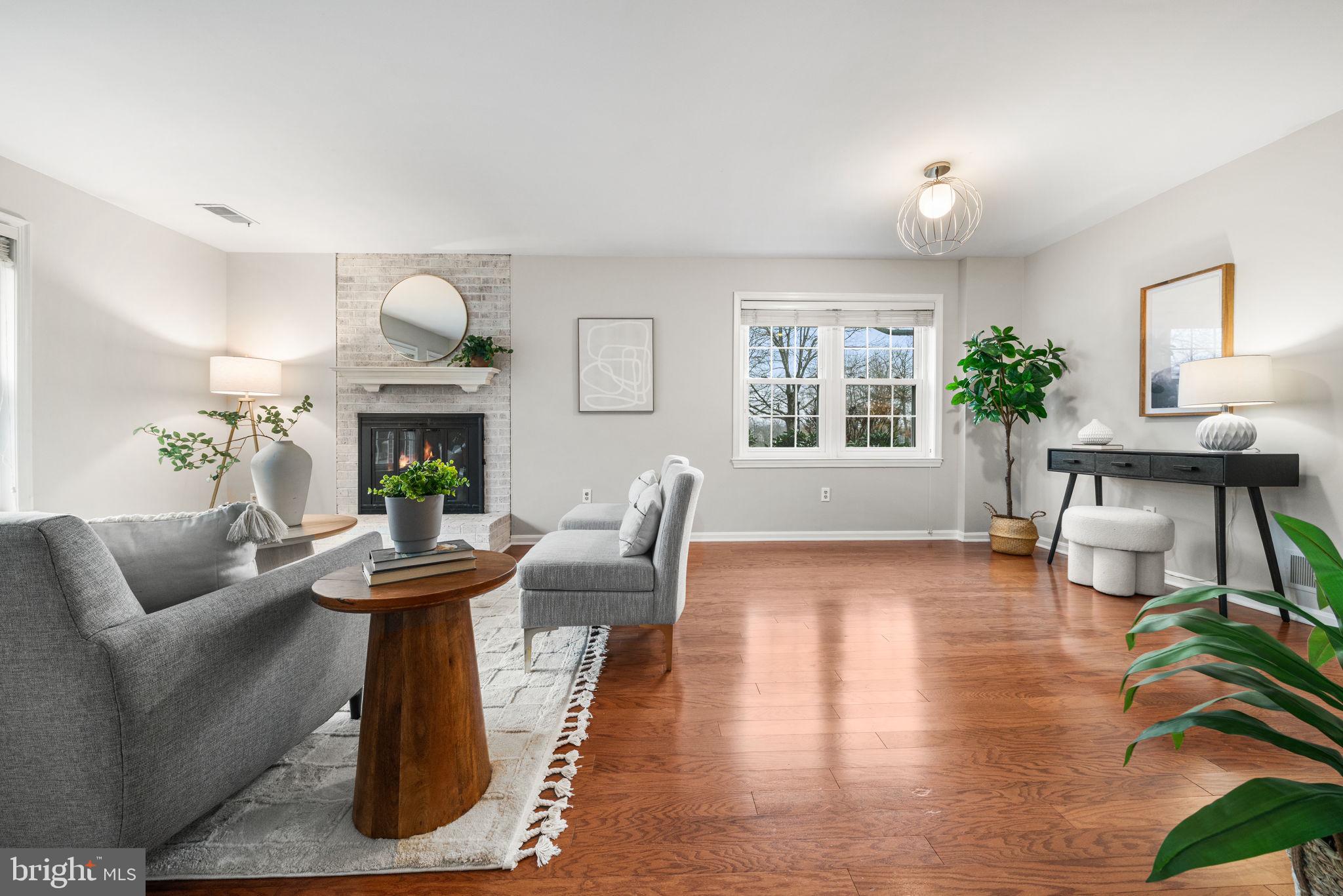 4931 7th Road South, Unit 4931 Arlington, VA 22204 - Photo 7 of 25 a living room with furniture a potted plant and a fireplace