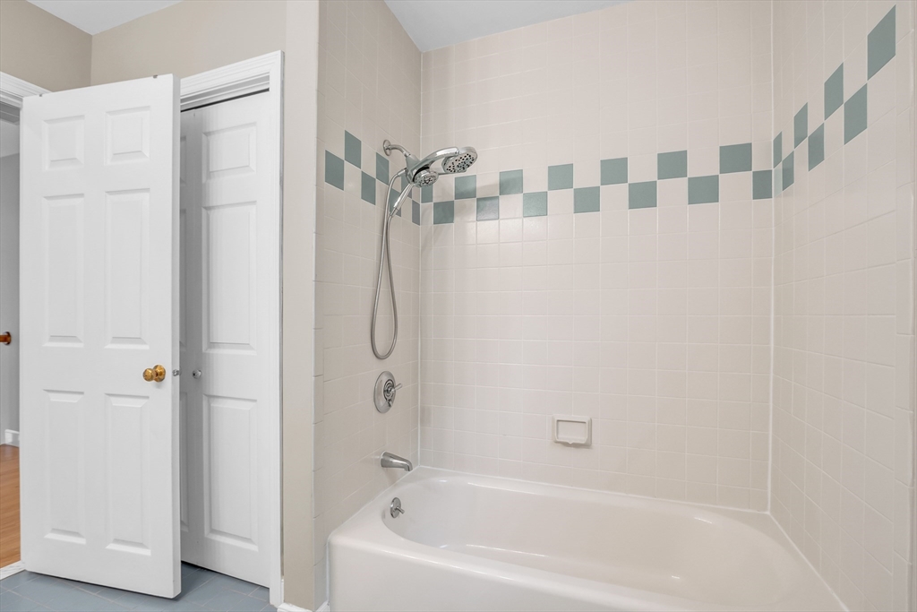 7 Apple Ridge Drive Natick, MA 01760 - Photo 20 of 42 a bathroom with a bathtub and a shower
