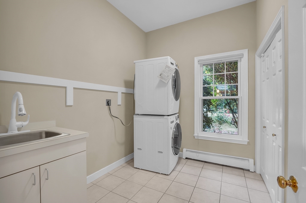 7 Apple Ridge Drive Natick, MA 01760 - Photo 26 of 42 a white refrigerator freezer sitting inside of a kitchen