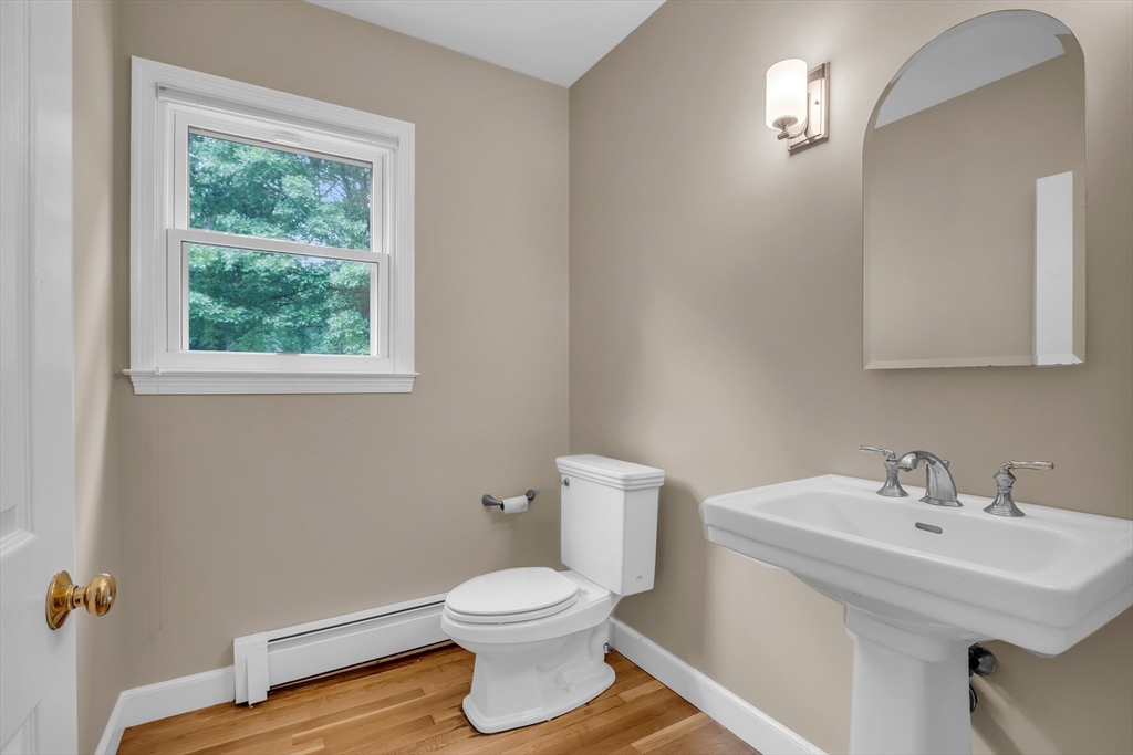 7 Apple Ridge Drive Natick, MA 01760 - Photo 27 of 42 a bathroom with a sink toilet and a window