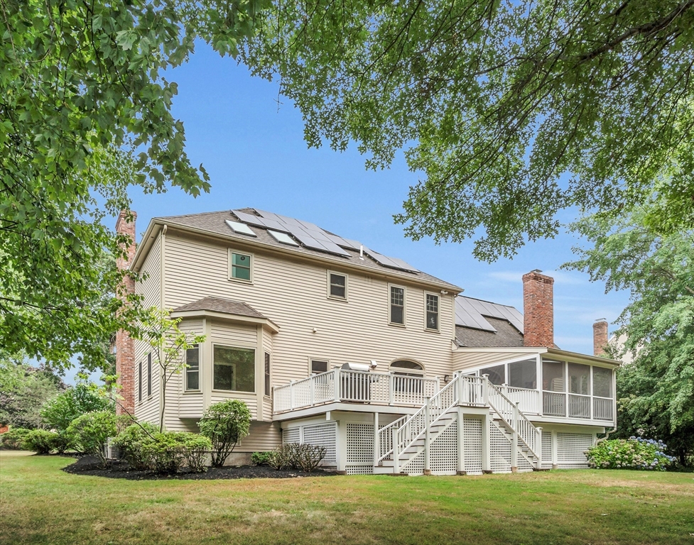 7 Apple Ridge Drive Natick, MA 01760 - Photo 30 of 42 a front view of a house with a garden