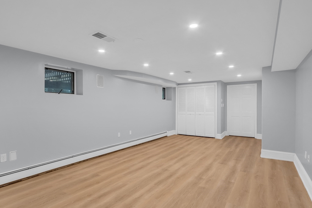 7 Apple Ridge Drive Natick, MA 01760 - Photo 34 of 42 a view of empty room with wooden floor