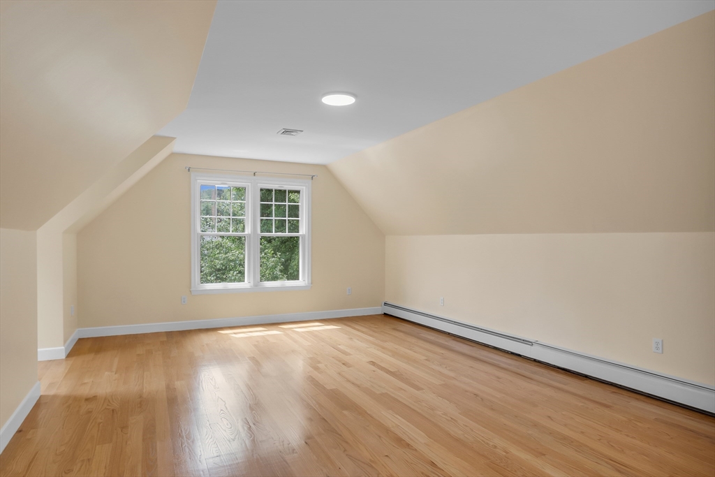 7 Apple Ridge Drive Natick, MA 01760 - Photo 37 of 42 an empty room with wooden floor and windows