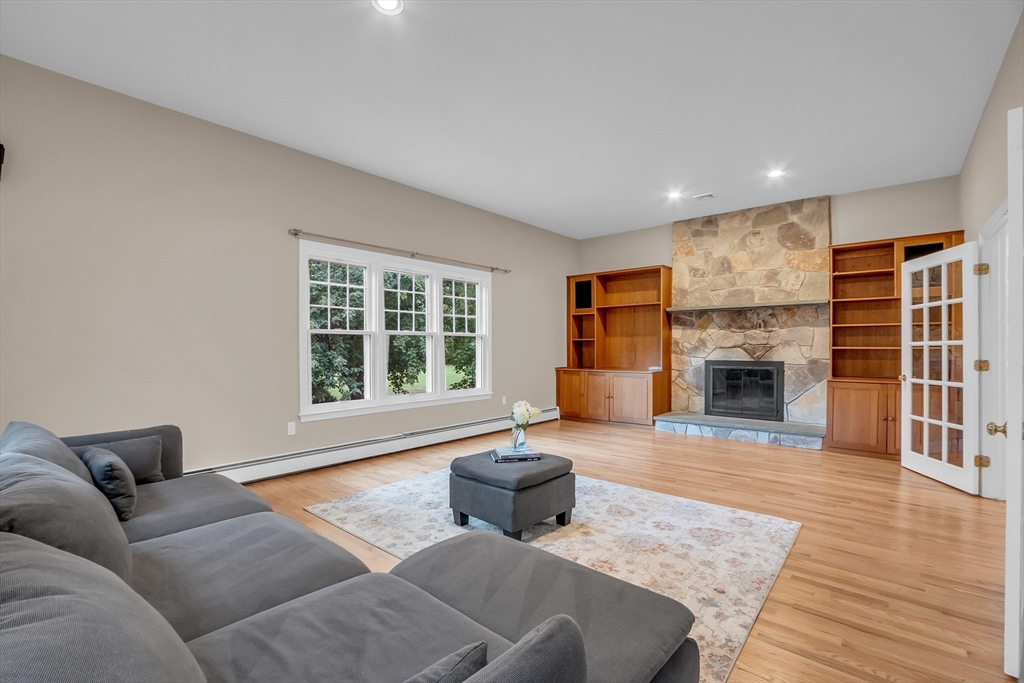 7 Apple Ridge Drive Natick, MA 01760 - Photo 8 of 42 a living room with furniture and a fireplace
