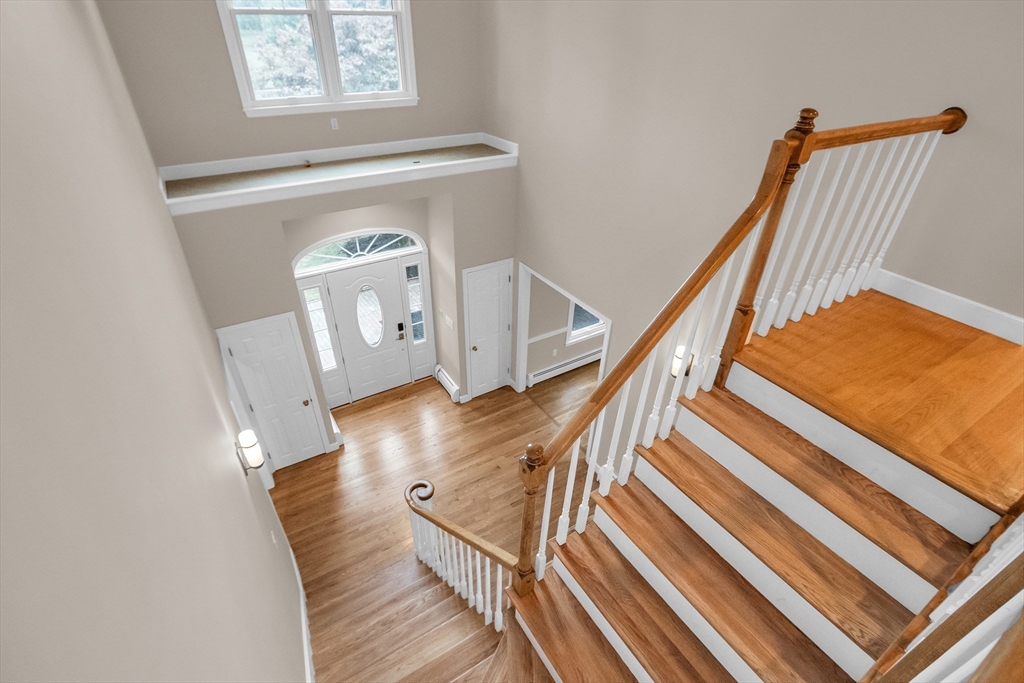 7 Apple Ridge Drive Natick, MA 01760 - Photo 10 of 42 a view of entryway and hall with wooden floor