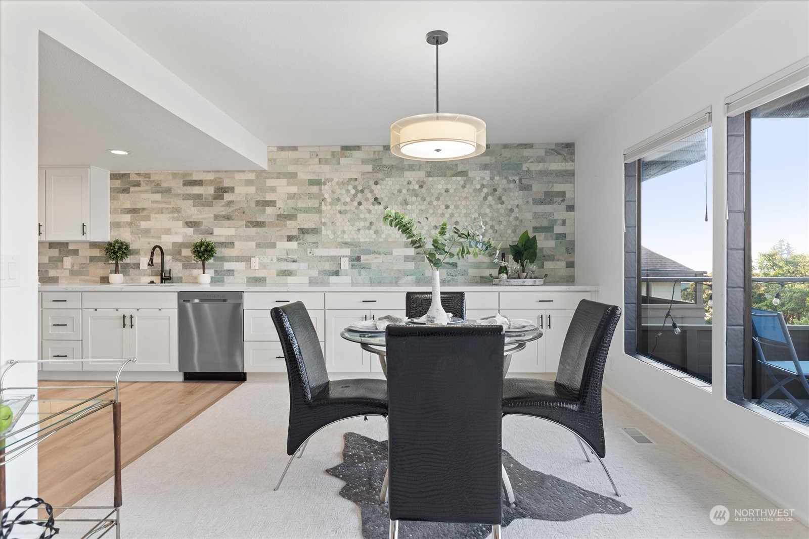 655 Main Street, Unit 202 Edmonds, WA 98020 - Photo 11 of 40 a view of a dining room with furniture window and outside view