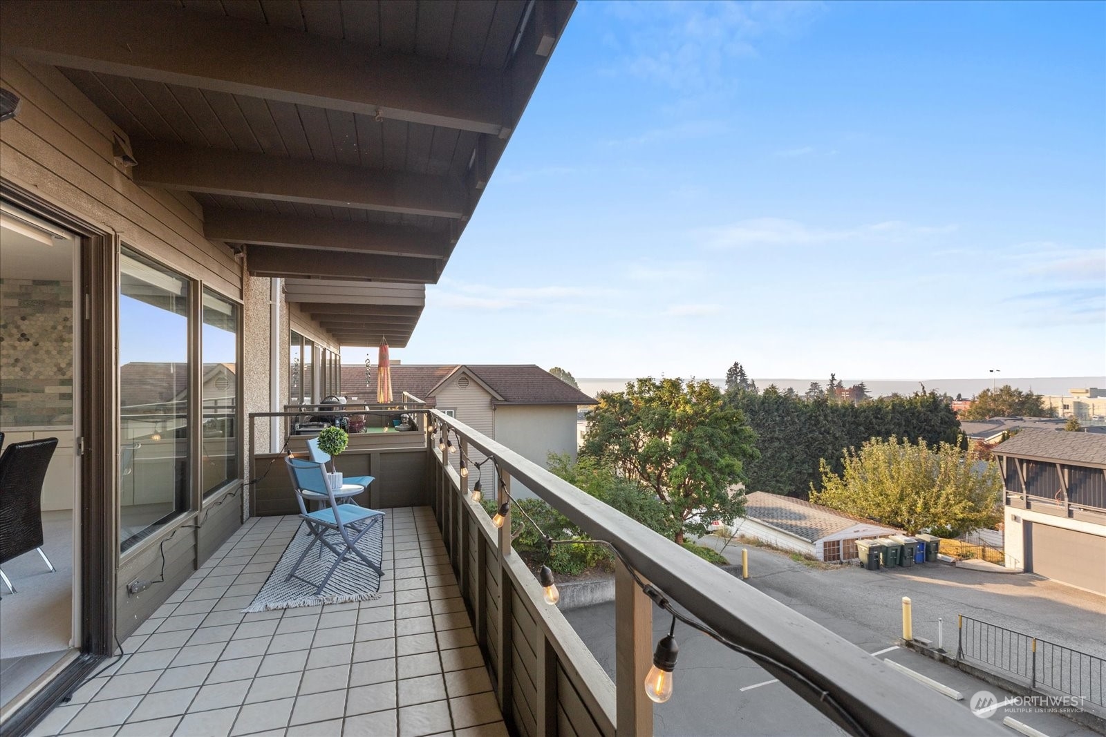 655 Main Street, Unit 202 Edmonds, WA 98020 - Photo 28 of 40 a view of a balcony with chairs