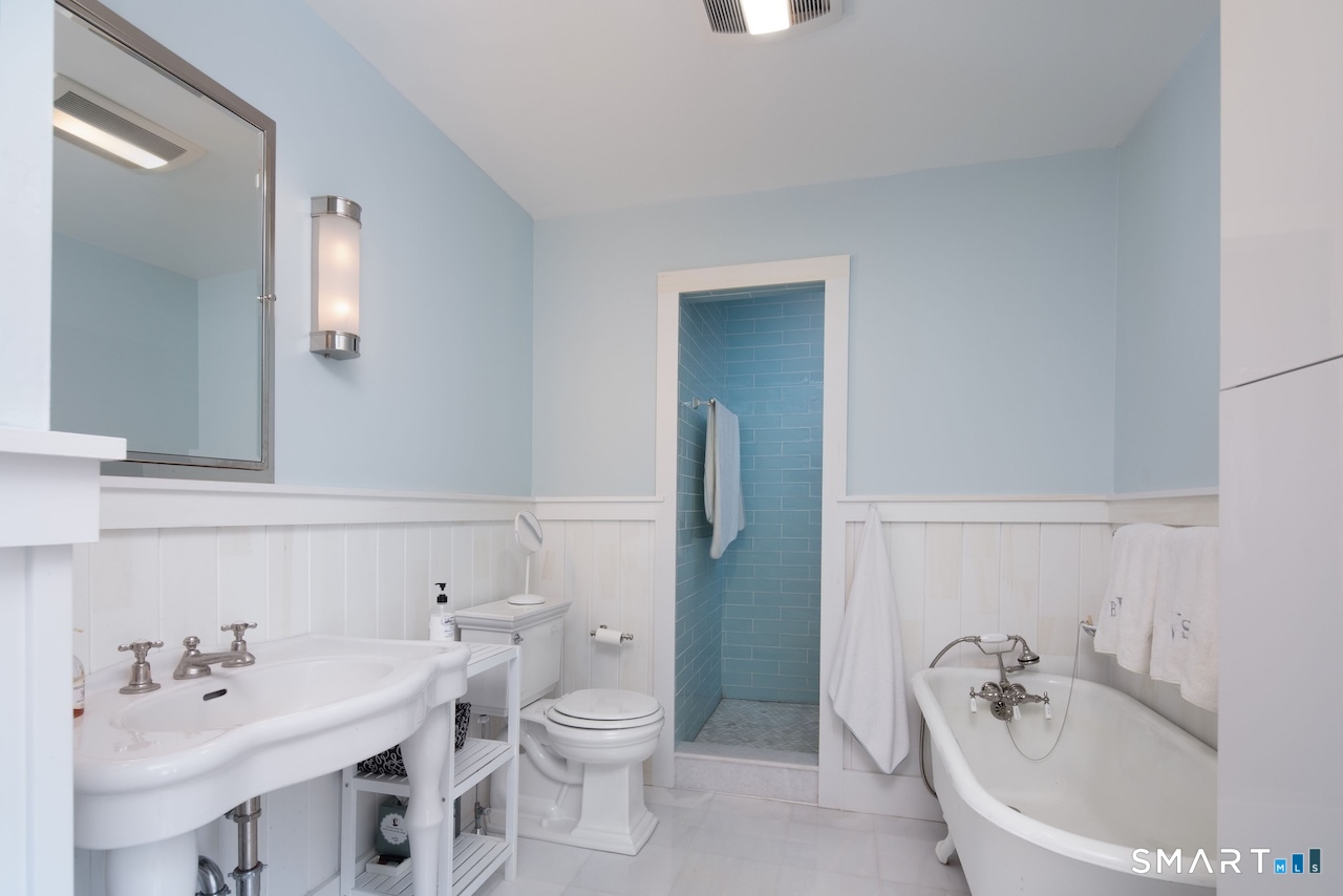 329 Housatonic River Road Salisbury, CT 06031 - Photo 29 of 32 a bathroom with a sink a toilet and a mirror