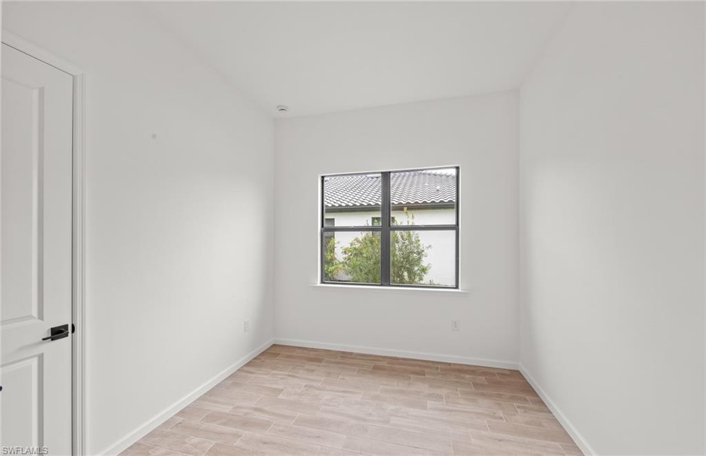 2107 Freemont Way Naples, FL 34120 - Photo 17 of 34 Enclosed flex room - solid doors & closet