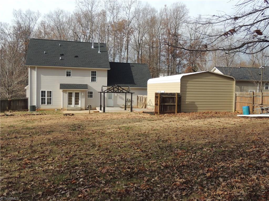 7606 Keating Drive Oak Ridge, NC 27310 - Photo 29 of 30 Backyard towards house