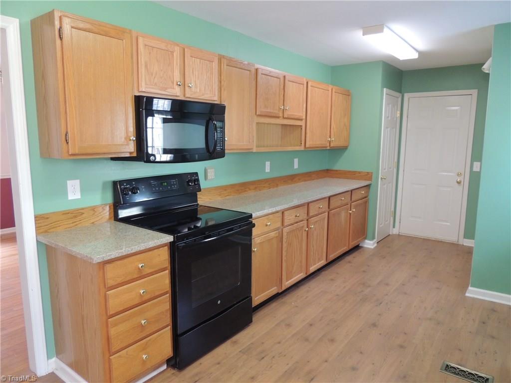7606 Keating Drive Oak Ridge, NC 27310 - Photo 7 of 30 Kitchen cooking and prep area
