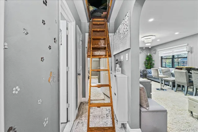 a view of a hallway with dining area and entryway