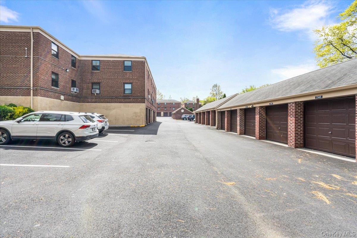 217-08 73rd Avenue, Unit 383A2 Queens, NY 11364 - Photo 20 of 24 a view of car parked in front of building