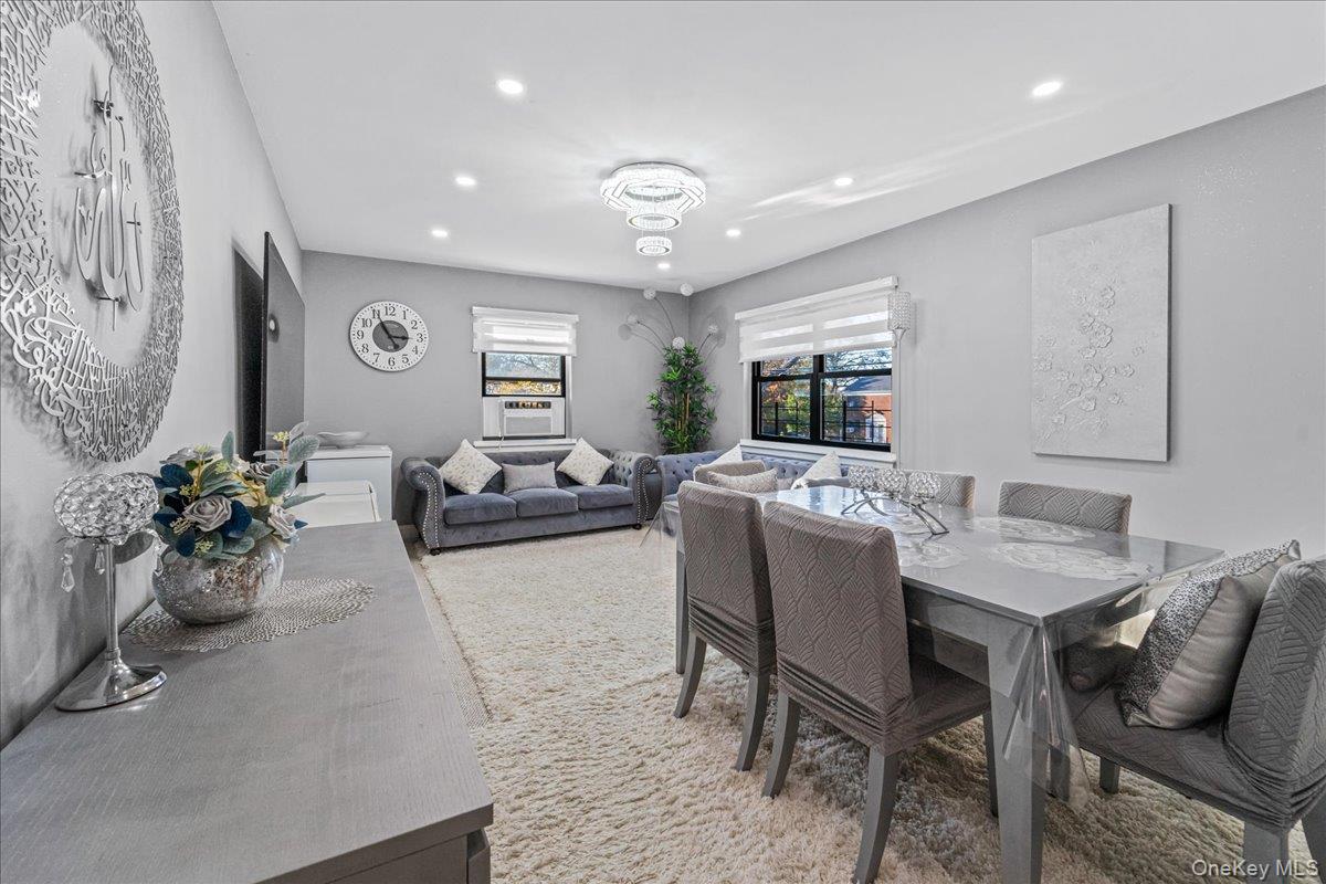 217-08 73rd Avenue, Unit 383A2 Queens, NY 11364 - Photo 4 of 24 a living room with furniture potted plant and window
