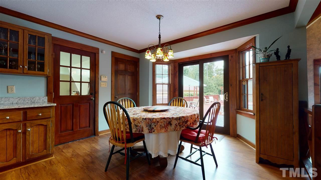 7010 Farmdale Road Raleigh, NC 27610 - Photo 15 of 30 a dining room with furniture window wooden floor